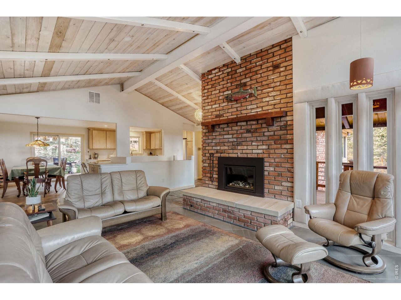 194 North Cedar Brook Road Boulder, CO 80304 - Photo 11 of 30 a living room with furniture and a fireplace