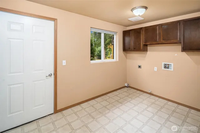 a view of a lake with houses in the back