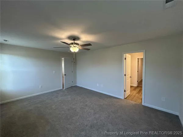 a view of a room with a fan