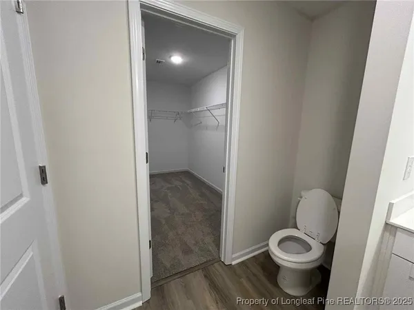 a bathroom with a toilet and a sink