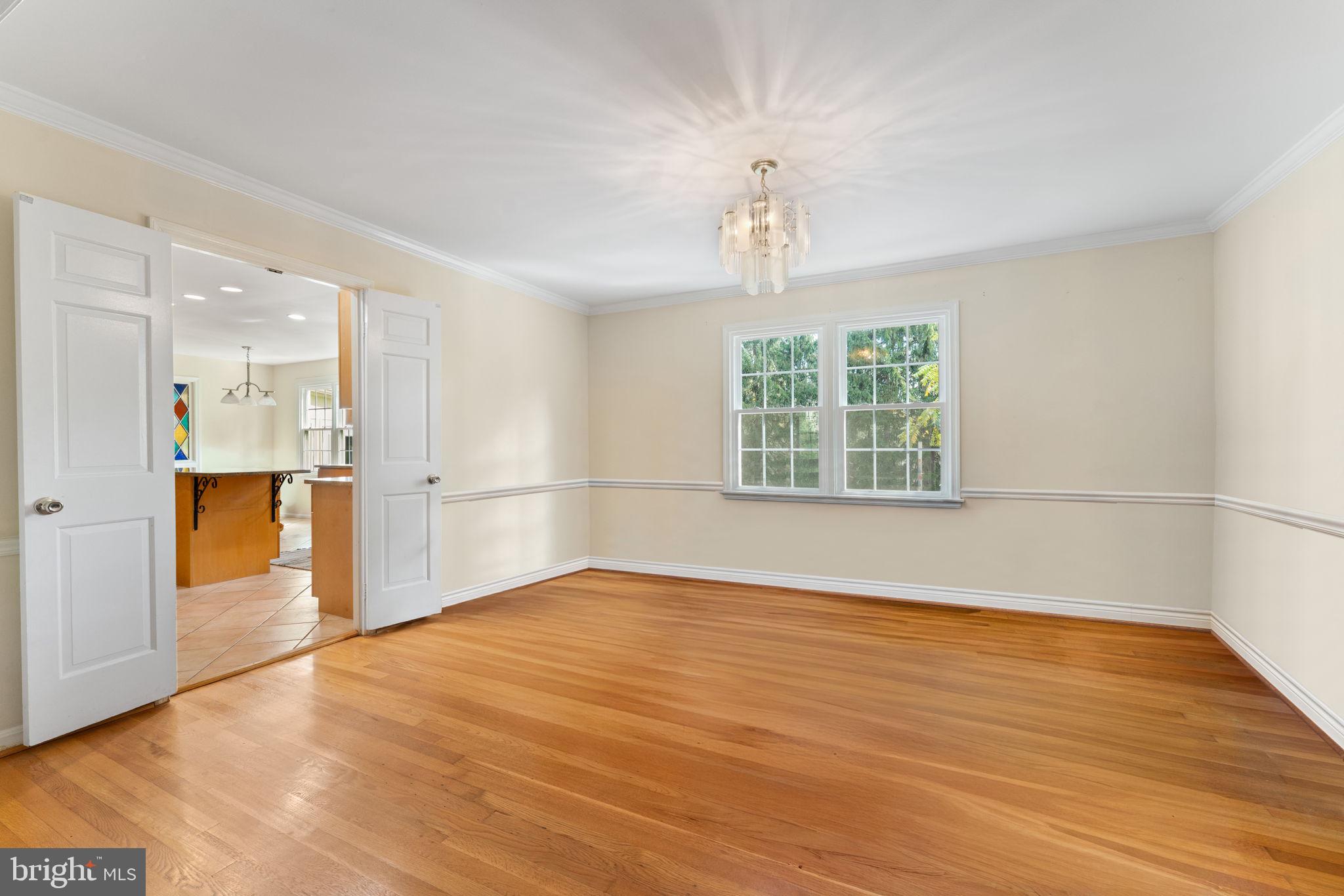 9 Snug Hill Court Potomac, MD 20854 - Photo 11 of 66 a view of empty room with wooden floor and fan
