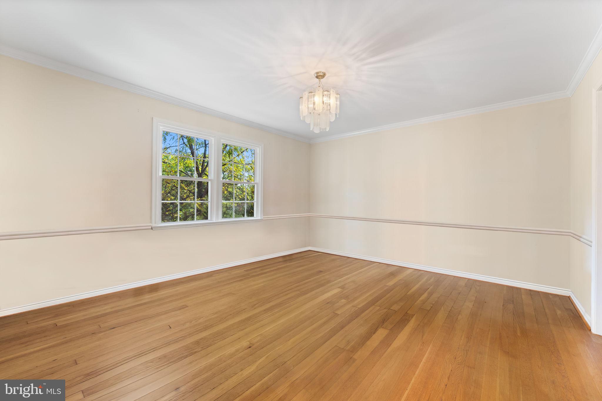 9 Snug Hill Court Potomac, MD 20854 - Photo 12 of 66 wooden floor in an empty room with a window
