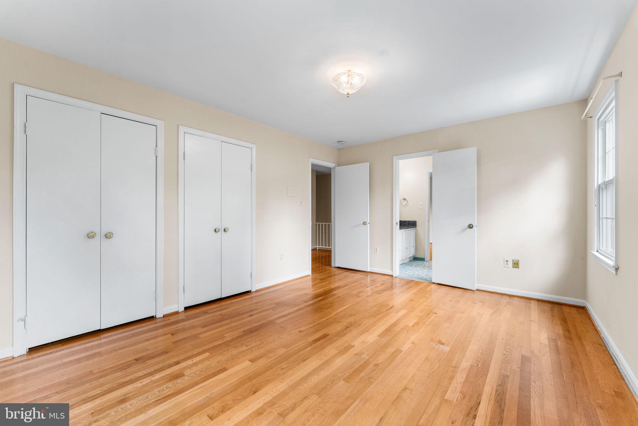 9 Snug Hill Court Potomac, MD 20854 - Photo 27 of 66 a view of an empty room with wooden floor and window