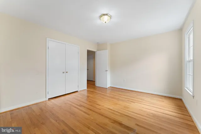 a view of an empty room with glass door