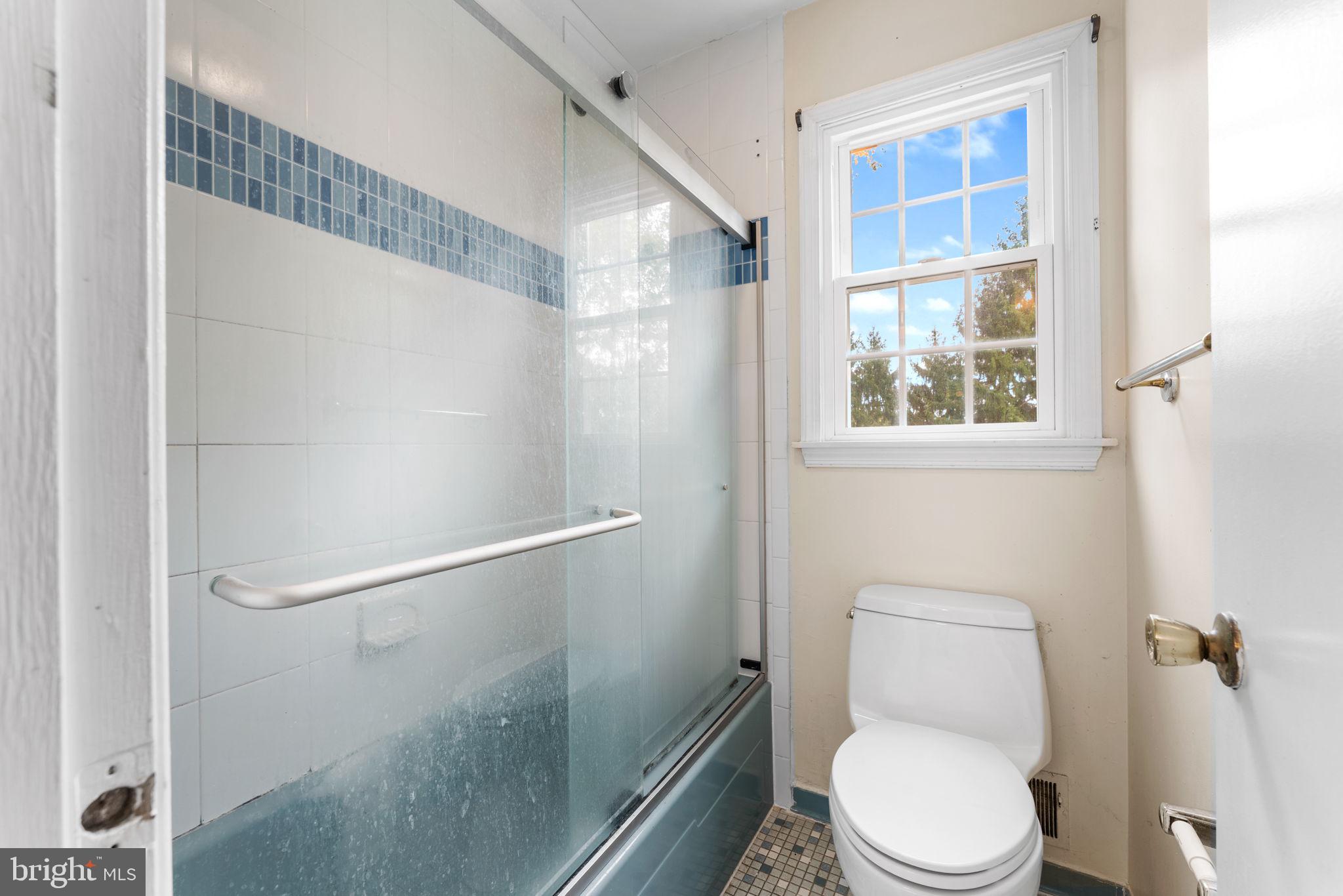 9 Snug Hill Court Potomac, MD 20854 - Photo 32 of 66 a white toilet sitting next to a bathroom sink