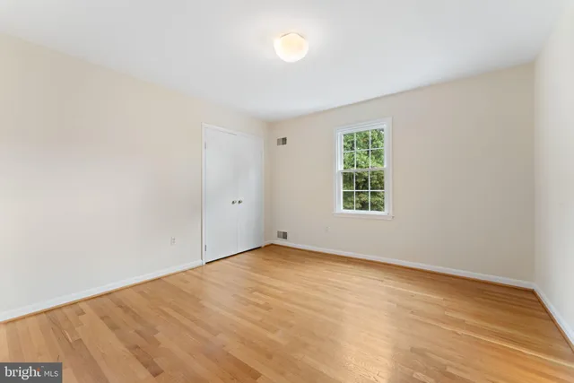 a view of an empty room with a bathroom