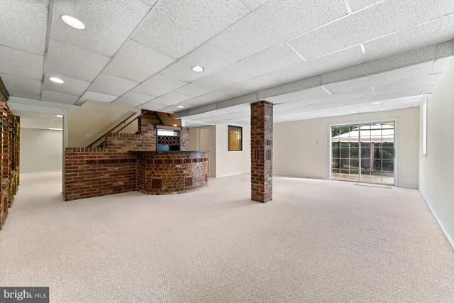 a view of a room with wooden floor and stairs