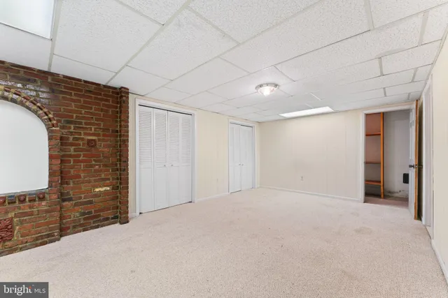 a view of a white house with a swimming pool