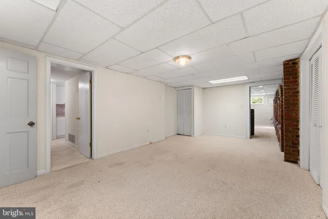 a view of a swimming pool with an outdoor seating and a yard