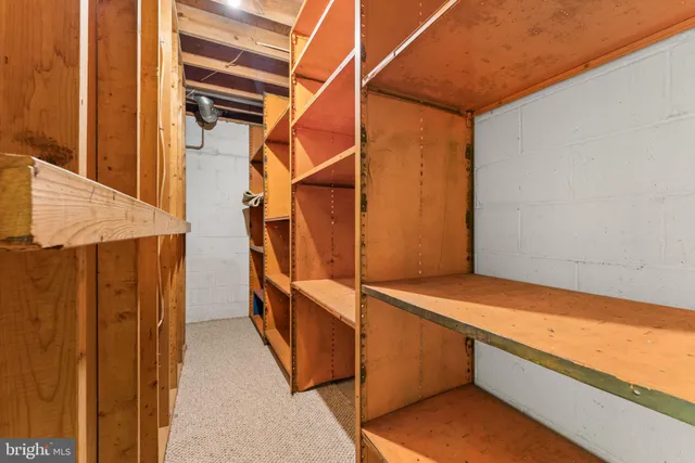 a view of a patio with couches table and chairs and potted plants
