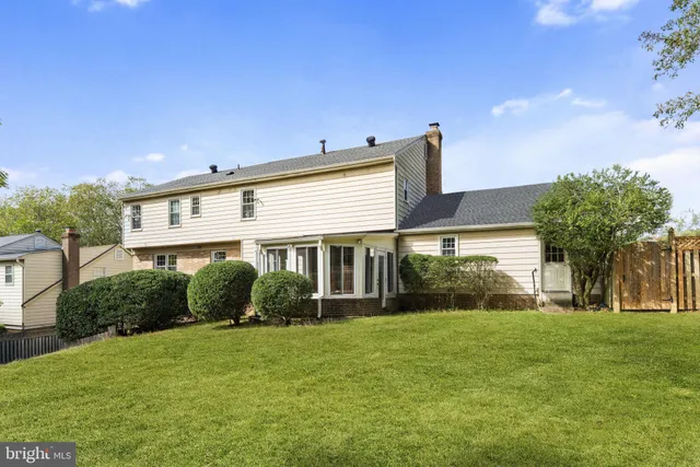 a view of a building with a large window and large tree