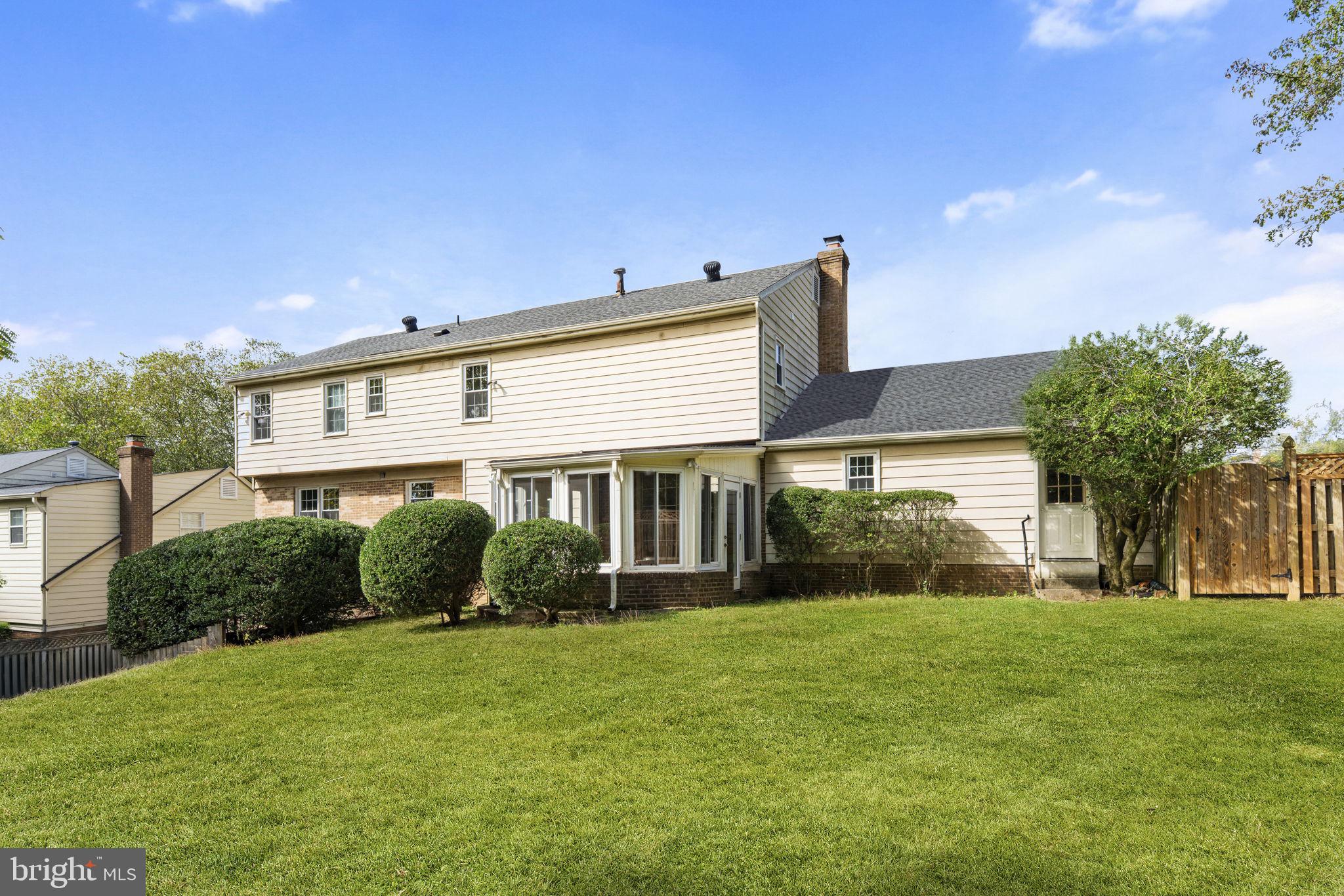 9 Snug Hill Court Potomac, MD 20854 - Photo 46 of 66 a front view of house with yard and green space