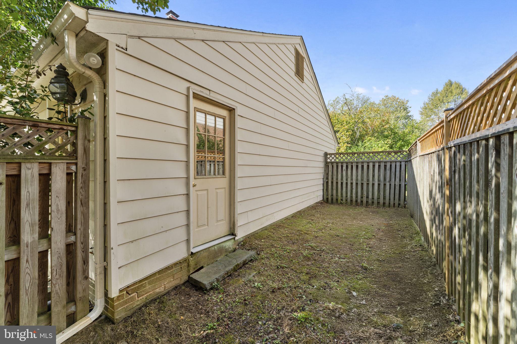 9 Snug Hill Court Potomac, MD 20854 - Photo 48 of 66 a view of a house with a backyard