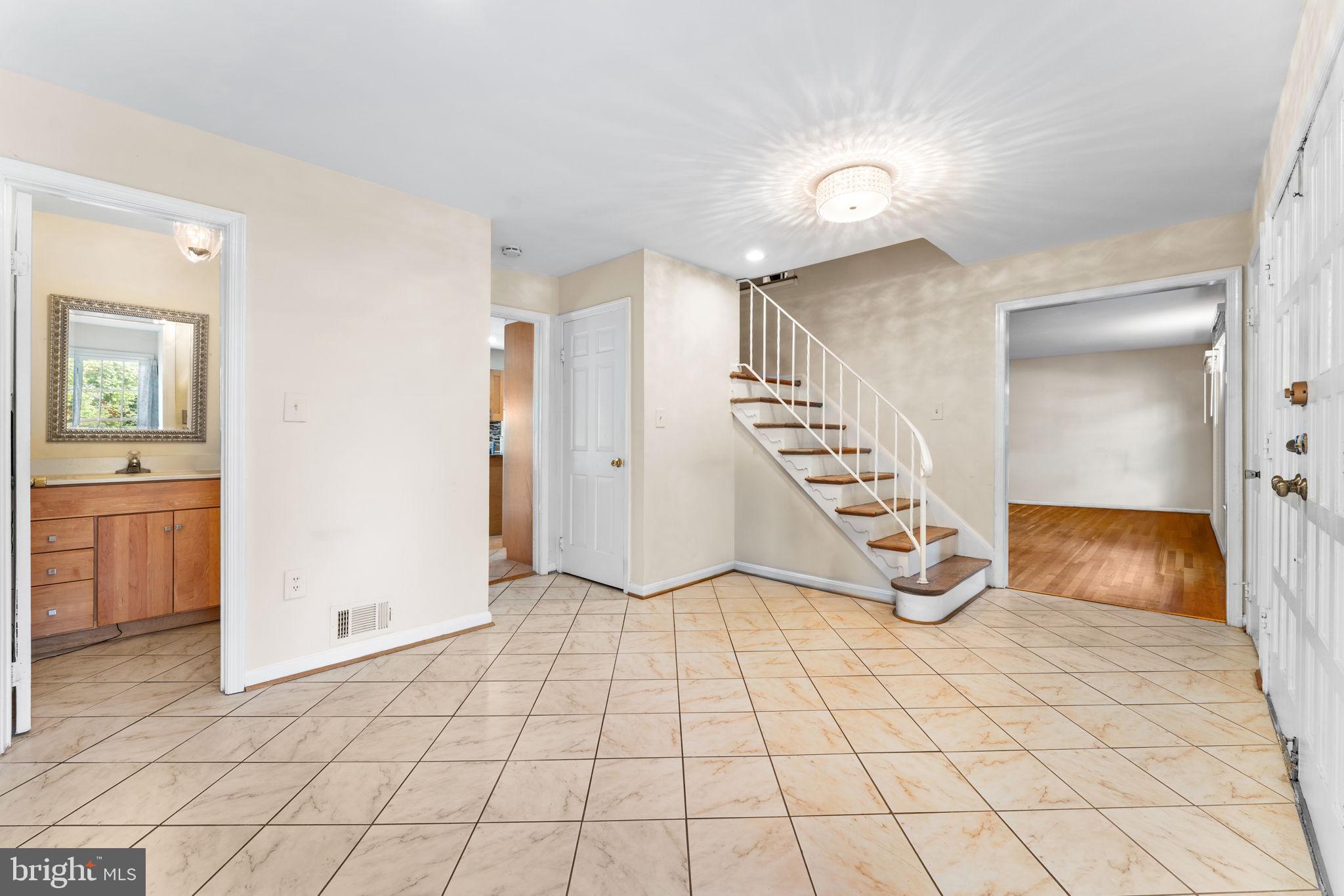 9 Snug Hill Court Potomac, MD 20854 - Photo 8 of 66 a view of an empty room and staircase