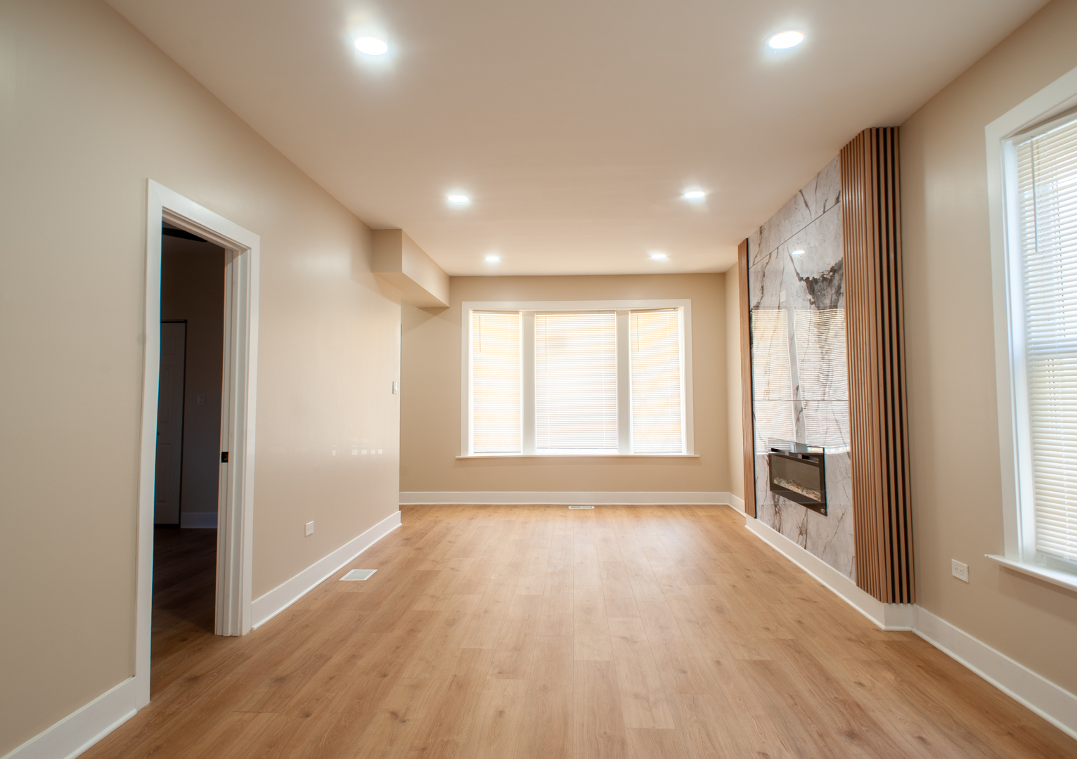 8620 South Union Avenue Chicago, IL 60620 - Photo 11 of 41 a view of an empty room with a window and wooden floor