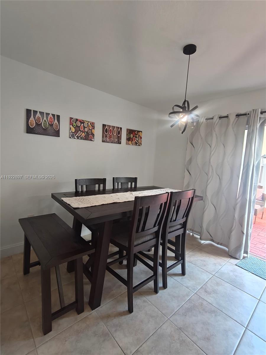 17847 Northwest 74th Path Hialeah, FL 33015 - Photo 14 of 35 a view of a dining room with furniture