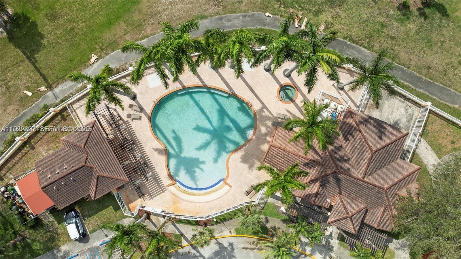 17847 Northwest 74th Path Hialeah, FL 33015 - Photo 2 of 35 an aerial view of a house with garden space and swimming pool