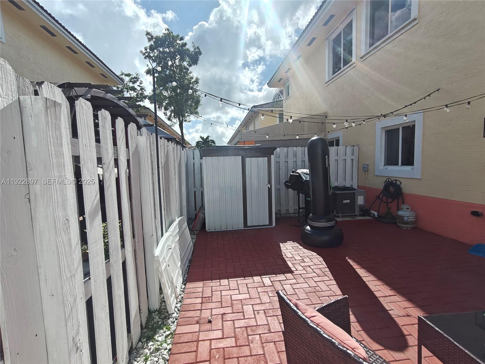 17847 Northwest 74th Path Hialeah, FL 33015 - Photo 33 of 35 a view of a porch with furniture and yard