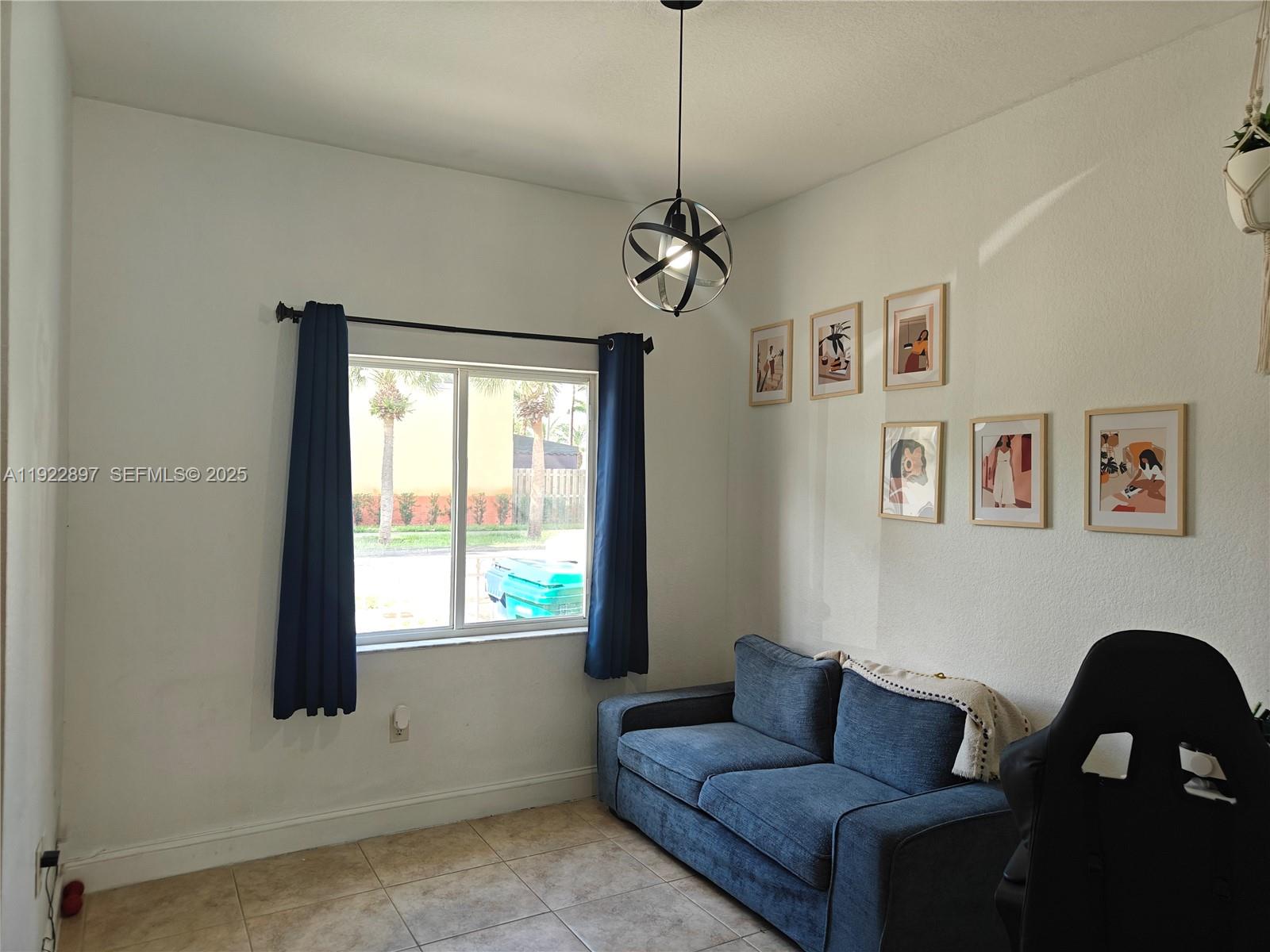 17847 Northwest 74th Path Hialeah, FL 33015 - Photo 7 of 35 a living room with furniture and a window