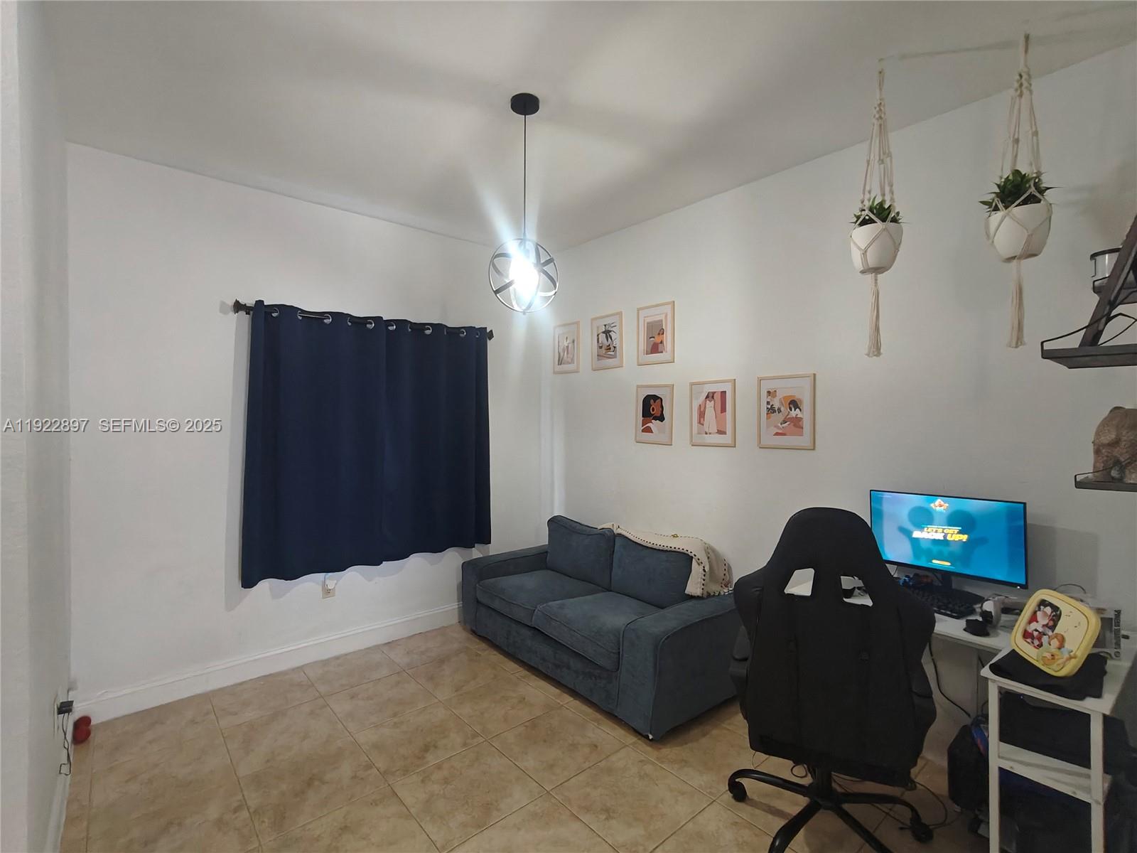 17847 Northwest 74th Path Hialeah, FL 33015 - Photo 8 of 35 a living room with furniture