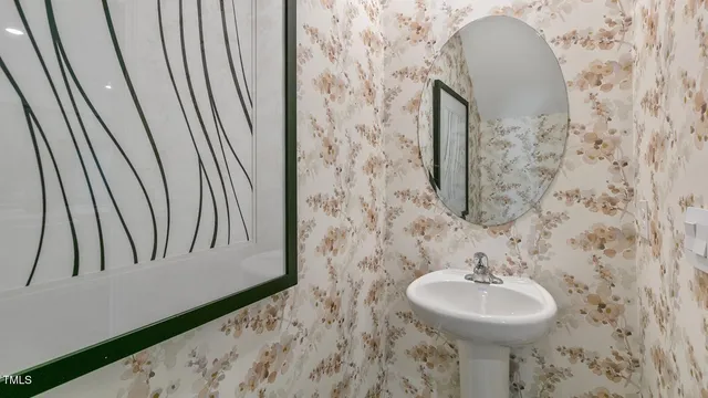 a bathroom with a sink and mirror