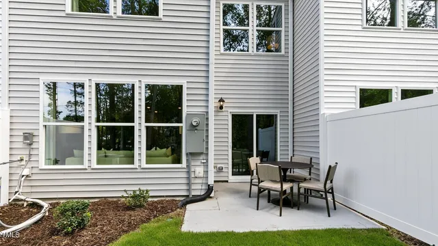 a view of a house with sitting area and balcony