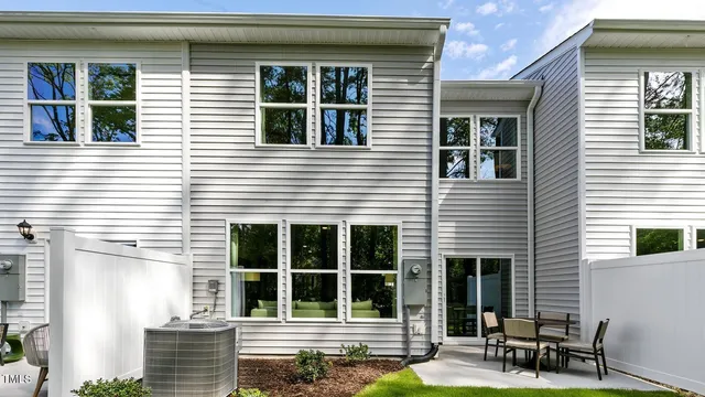 a house view with a sitting space and garden