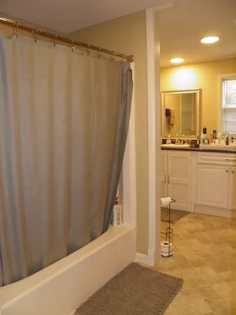 a view of a bathroom with a shower curtain