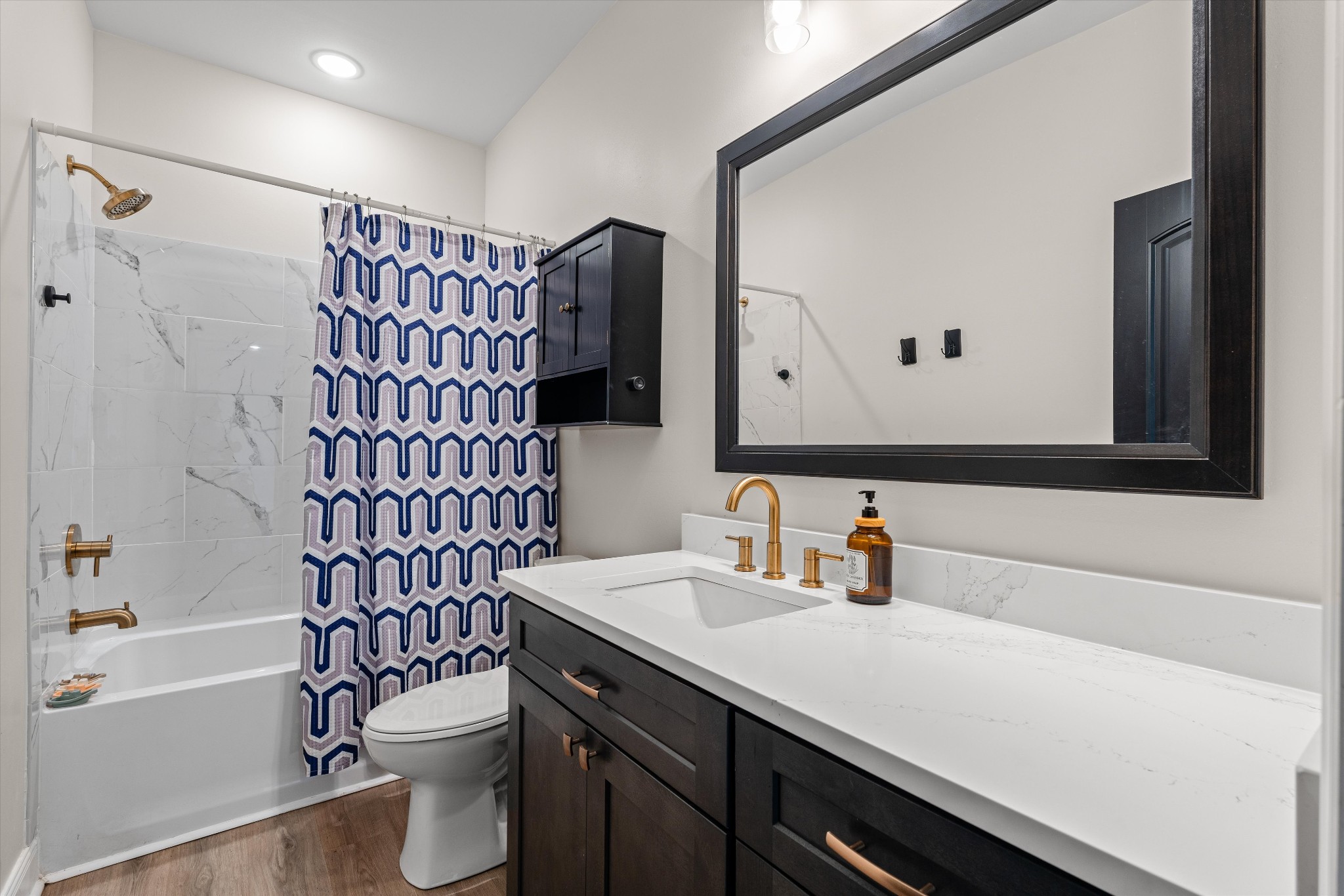 5195 Pleasant View Road Morrison, TN 37357 - Photo 34 of 45 a bathroom with a sink toilet vanity and shower