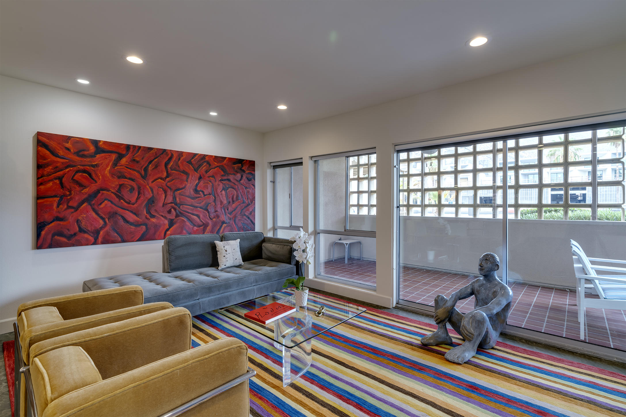 277 East Alejo Road, Unit 101 Palm Springs, CA 92262 - Photo 12 of 30 a living room with furniture and a floor to ceiling window