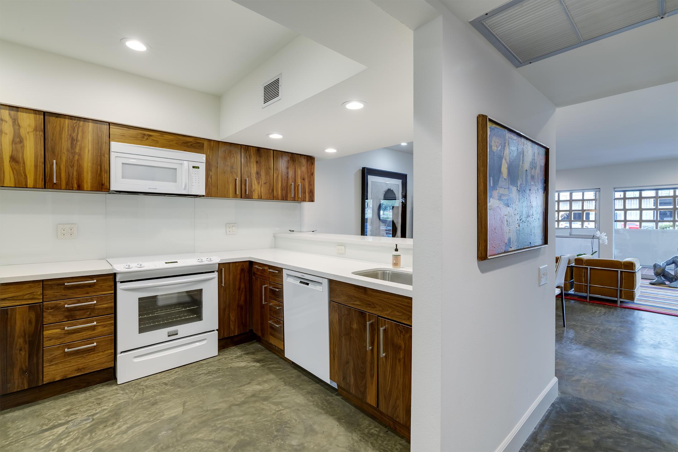 277 East Alejo Road, Unit 101 Palm Springs, CA 92262 - Photo 14 of 30 a kitchen with stainless steel appliances granite countertop a stove and a sink