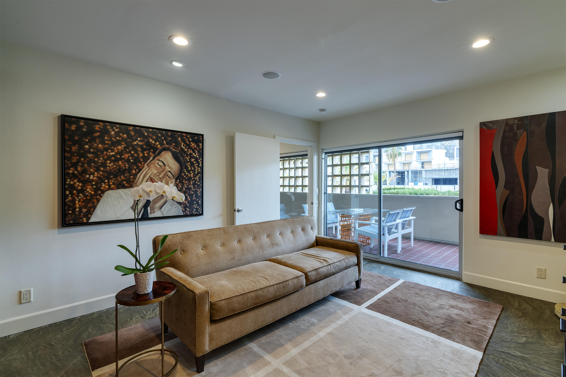 277 East Alejo Road, Unit 101 Palm Springs, CA 92262 - Photo 18 of 30 a living room with furniture a rug and a large window