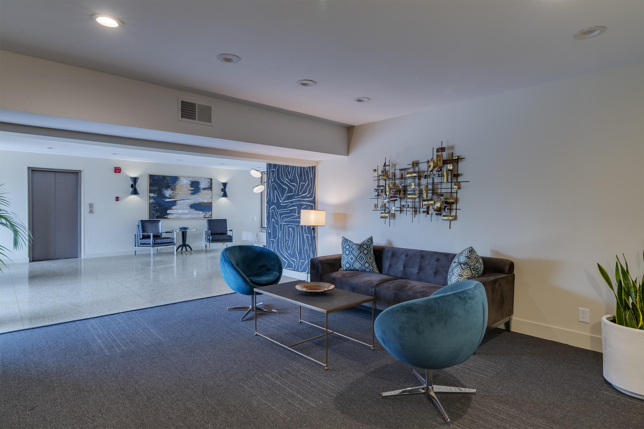 277 East Alejo Road, Unit 101 Palm Springs, CA 92262 - Photo 23 of 30 a living room with furniture and a chair