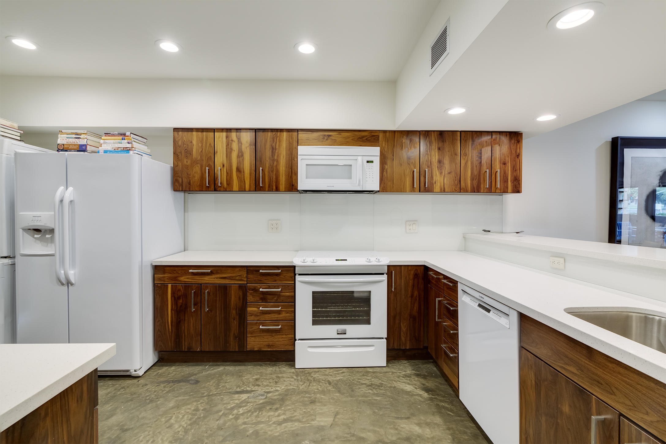 277 East Alejo Road, Unit 101 Palm Springs, CA 92262 - Photo 4 of 30 a kitchen with stainless steel appliances granite countertop a sink and cabinets