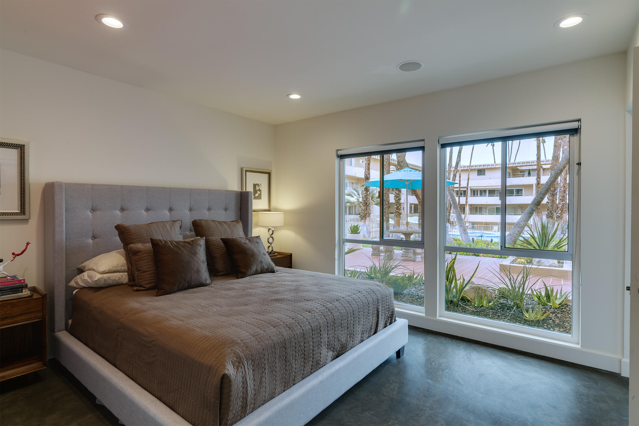 277 East Alejo Road, Unit 101 Palm Springs, CA 92262 - Photo 5 of 30 a bedroom with a large bed and a large window