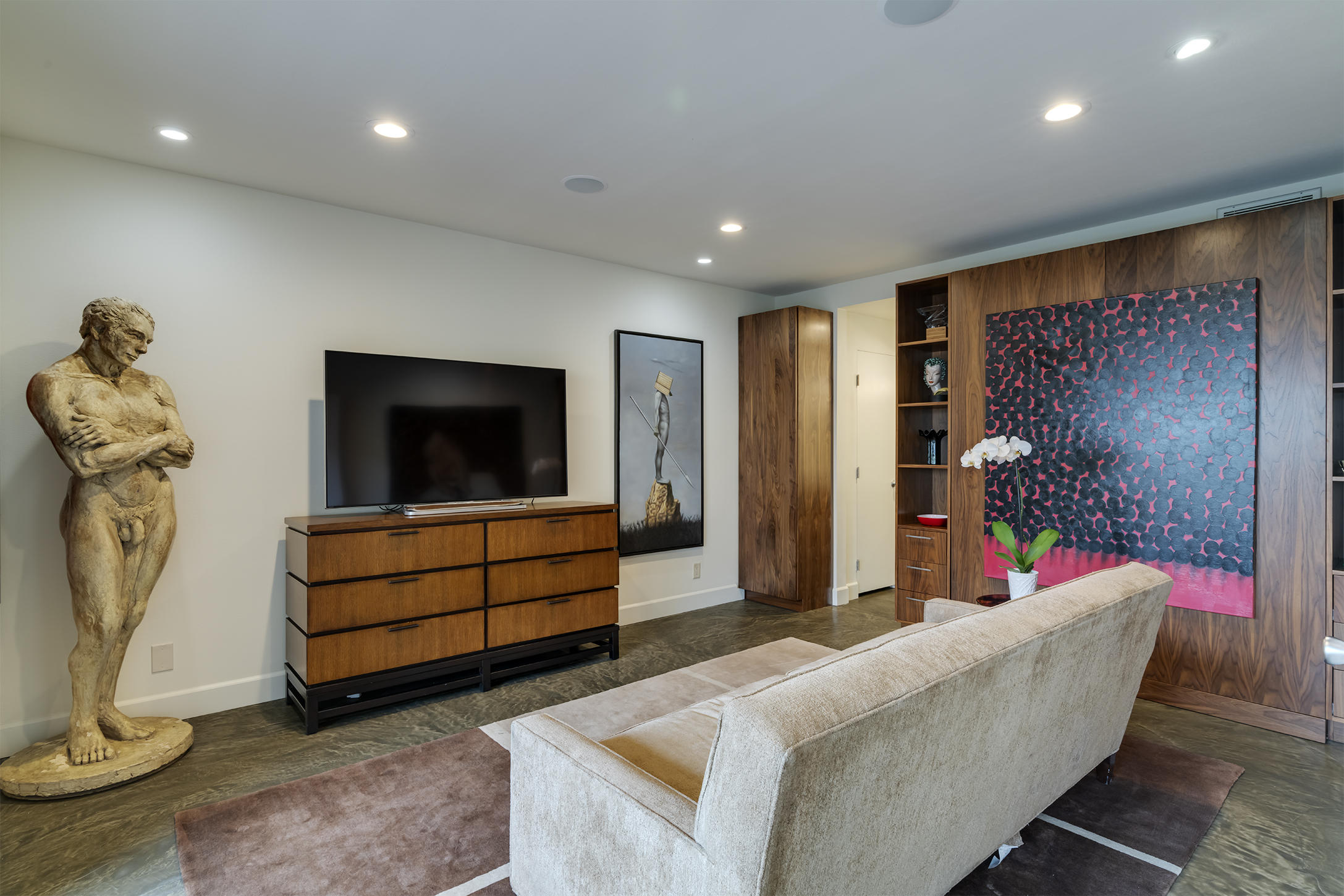 277 East Alejo Road, Unit 101 Palm Springs, CA 92262 - Photo 7 of 30 a living room with furniture and a flat screen tv