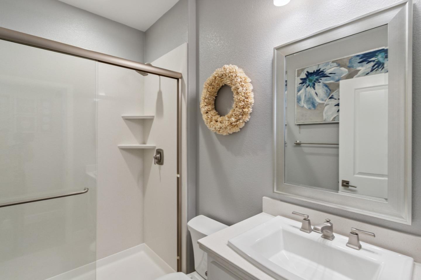 2610 Lighthouse Lane Marina, CA 93933 - Photo 17 of 43 a bathroom with a sink and a mirror