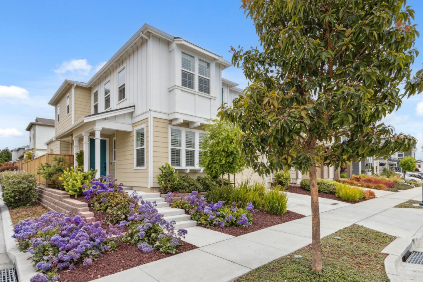 2610 Lighthouse Lane Marina, CA 93933 - Photo 2 of 43 a front view of a house with a yard and flowers