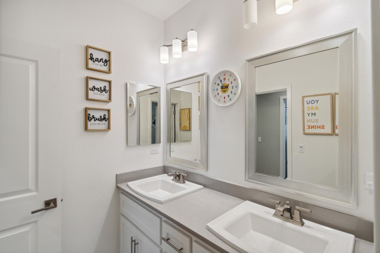 2610 Lighthouse Lane Marina, CA 93933 - Photo 22 of 43 a bathroom with double vanity sinks and a mirror