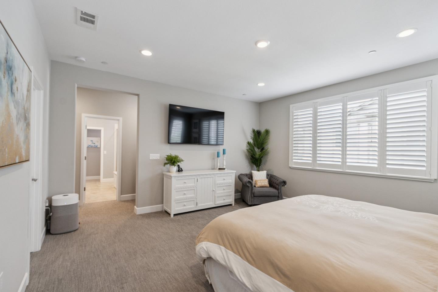 2610 Lighthouse Lane Marina, CA 93933 - Photo 29 of 43 a bedroom with a bed and a flat screen tv