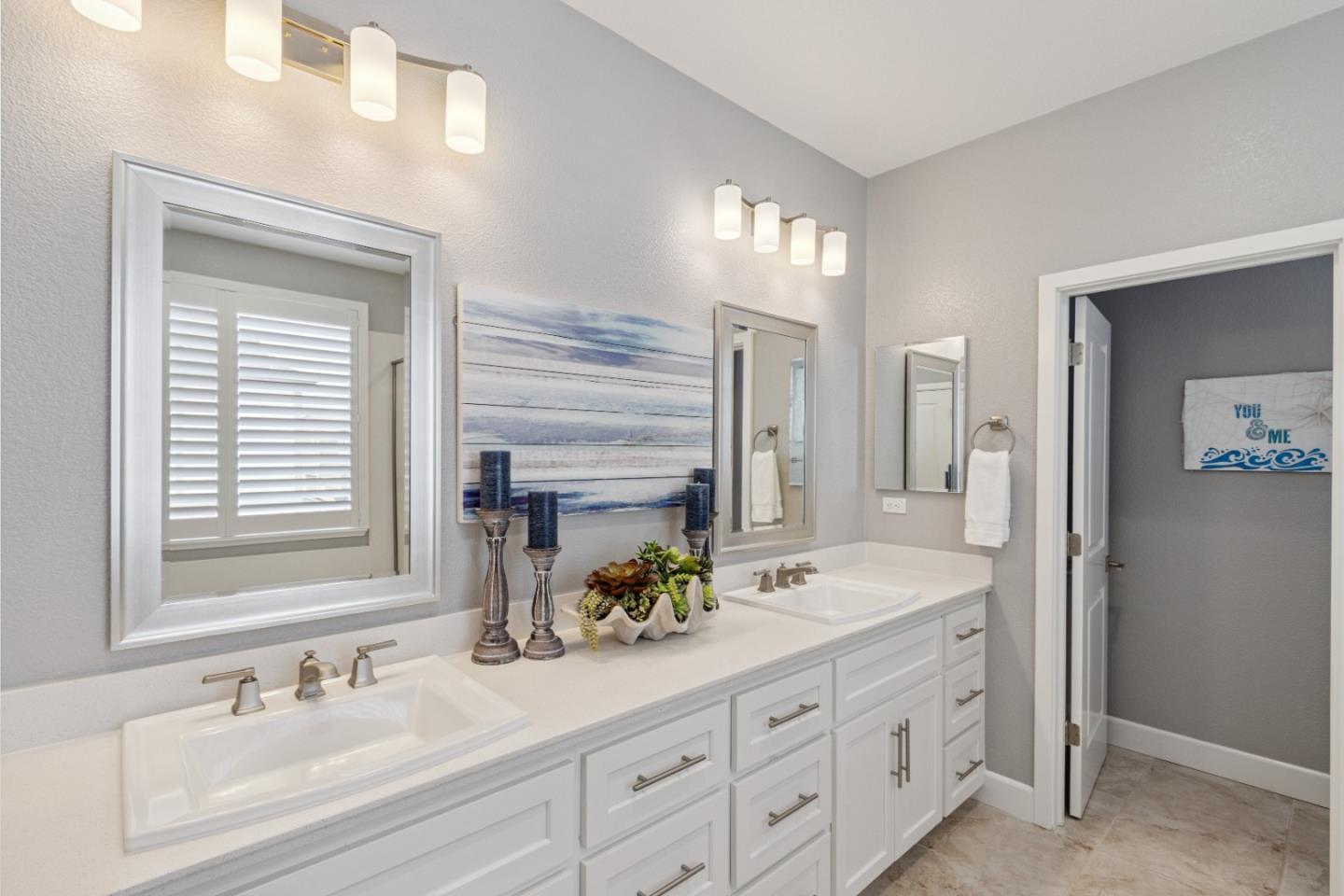 2610 Lighthouse Lane Marina, CA 93933 - Photo 30 of 43 a bathroom with double sink and a mirror