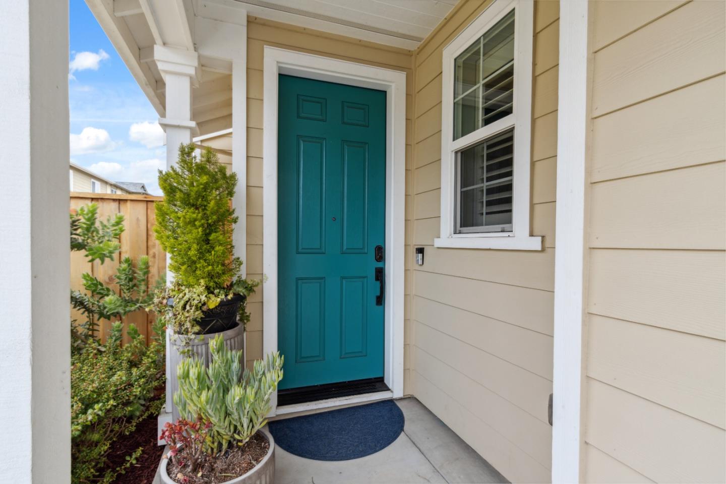 2610 Lighthouse Lane Marina, CA 93933 - Photo 3 of 43 a potted plant in front of a door