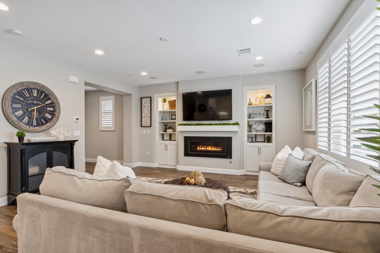 2610 Lighthouse Lane Marina, CA 93933 - Photo 7 of 43 a living room with furniture a fireplace and a flat screen tv