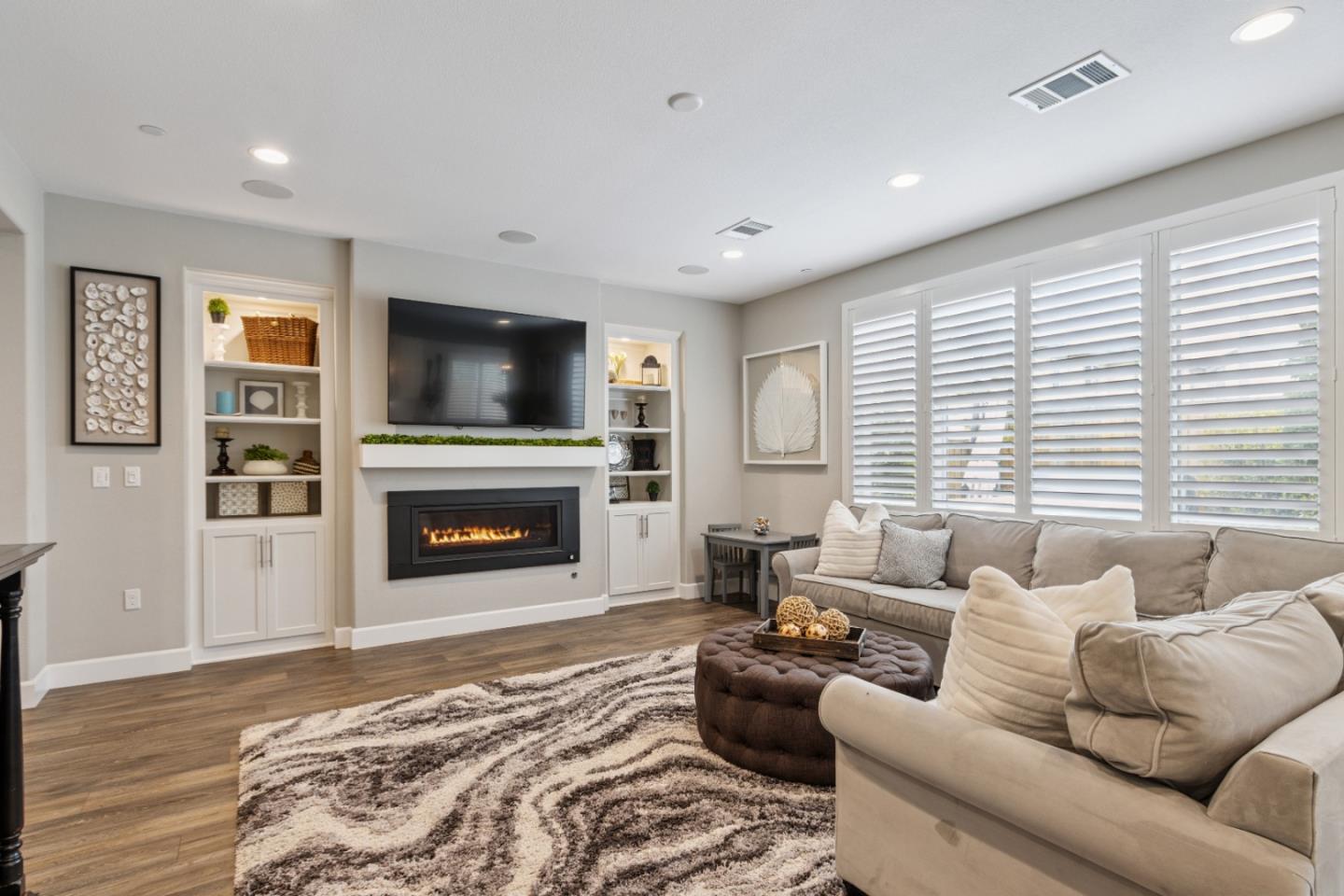 2610 Lighthouse Lane Marina, CA 93933 - Photo 8 of 43 a living room with furniture a flat screen tv and a fireplace