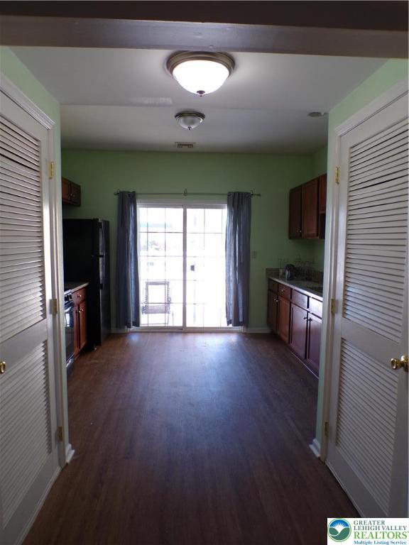 2022 Mercer Way Easton, PA 18040 - Photo 4 of 13 an empty room with wooden floor and windows