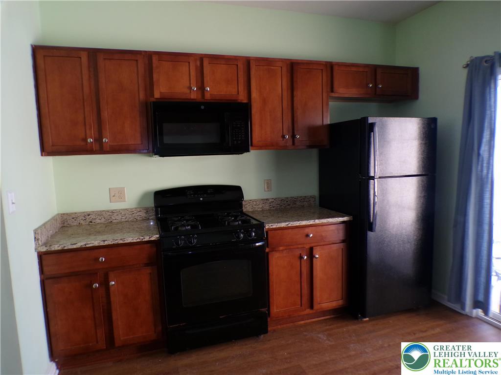 2022 Mercer Way Easton, PA 18040 - Photo 5 of 13 a kitchen with a refrigerator and a microwave