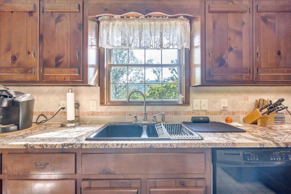 3737 Bore Auger Road Blue Ridge, VA 24064 - Photo 17 of 100 a kitchen with granite countertop a sink and a window