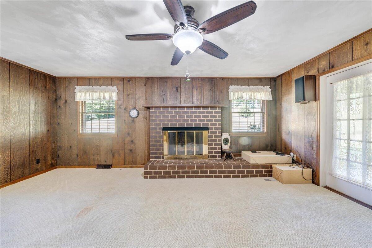 3737 Bore Auger Road Blue Ridge, VA 24064 - Photo 24 of 100 a living room with furniture and a fireplace