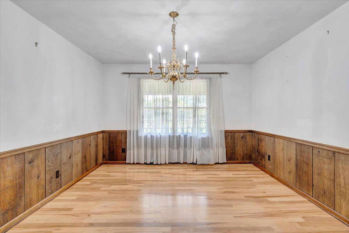 3737 Bore Auger Road Blue Ridge, VA 24064 - Photo 31 of 100 a view of a room with wooden floor and windows