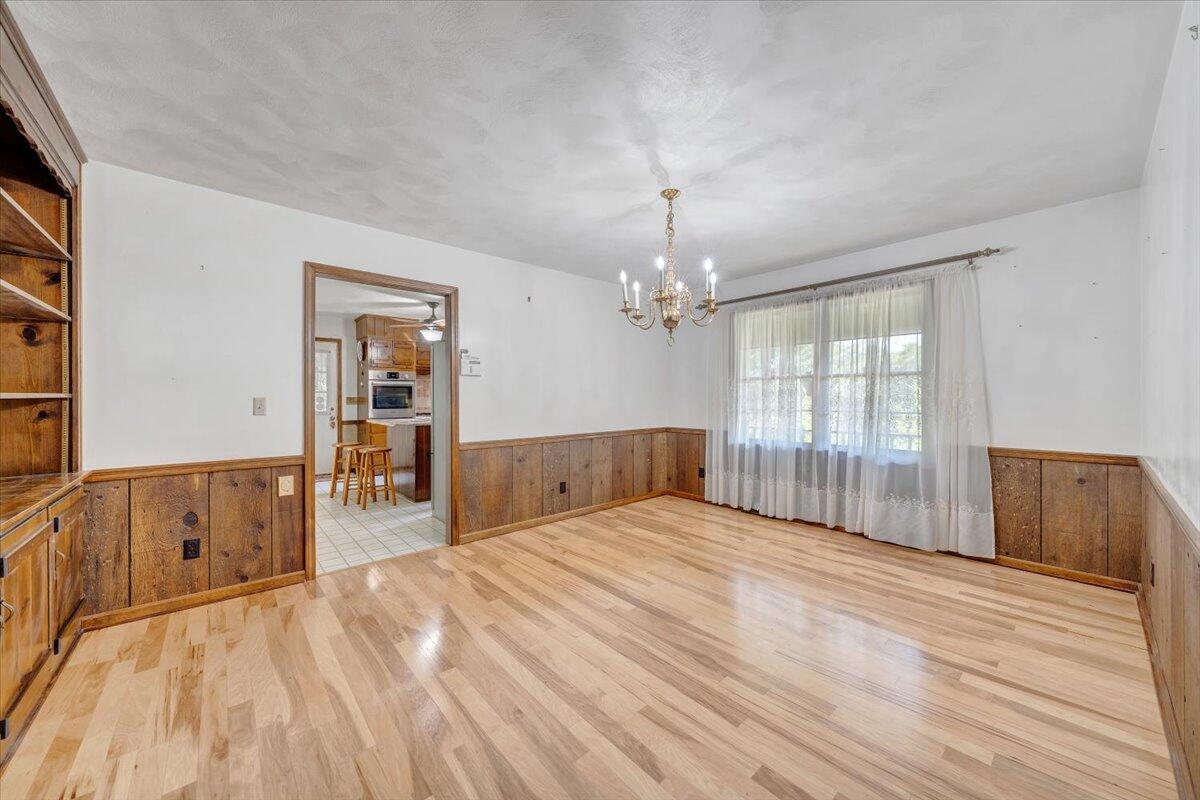 3737 Bore Auger Road Blue Ridge, VA 24064 - Photo 34 of 100 a view of a bedroom with wooden floor and a window
